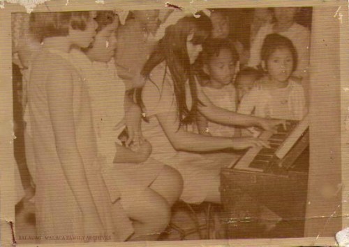 My Mom as a young lady playing at a church in Pampanga.