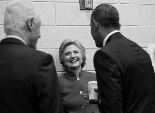 Hillary Clinton, all smiles while chatting with Bill and President Barack Obama during the Democratic National Convention this year [photo by Barbara Kinney]